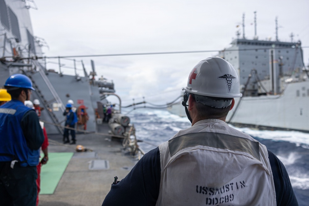 USS Mustin conducts a replenishment-at-sea with USNS Alan Shepard
