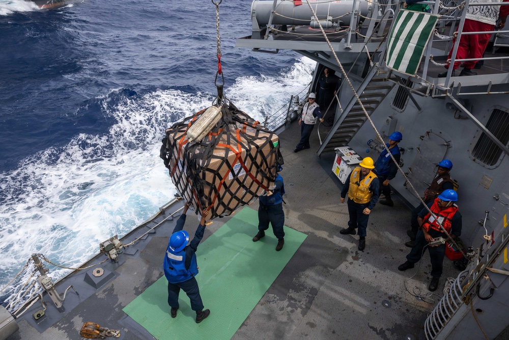USS Mustin conducts a replenishment-at-sea with USNS Alan Shepard