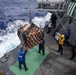 USS Mustin conducts a replenishment-at-sea with USNS Alan Shepard