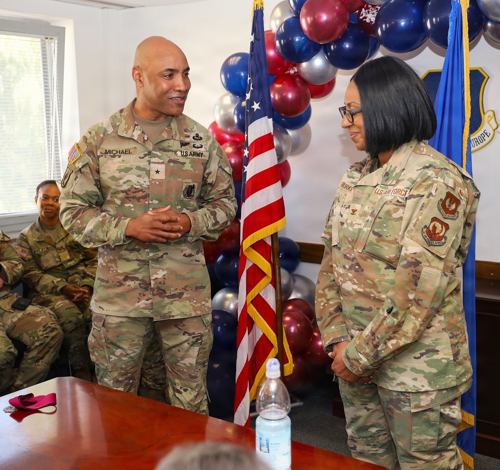 U.S. Army Brigadier General Michael Speaks with U.S. Air Force Service Member at USAFE-AFAF Event