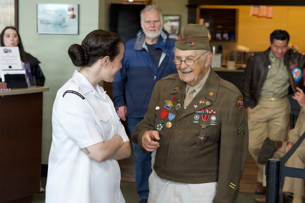 MU2 Maria Mandico meets CPL Wilbur “Jack” Myers, a World War II veteran who served as a gunner with the 692nd Tank Destroyer Battalion and participated in campaigns across Europe during the war.