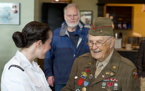 MU2 Maria Mandico meets CPL Wilbur “Jack” Myers, a World War II veteran who served as a gunner with the 692nd Tank Destroyer Battalion and participated in campaigns across Europe during the war.