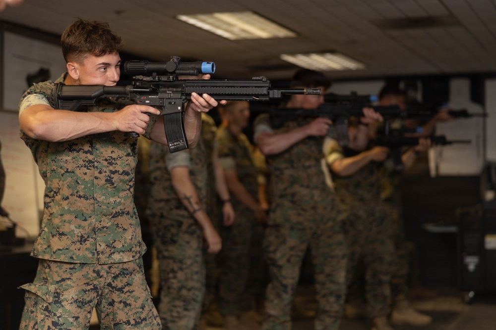 U.S. Naval Academy Midshipmen Train Indoor Simulated Marksmanship Trainer