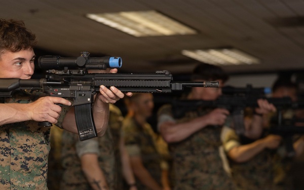 U.S. Naval Academy Midshipmen Train Indoor Simulated Marksmanship Trainer