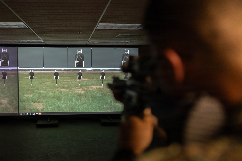 U.S. Naval Academy Midshipmen Train Indoor Simulated Marksmanship Trainer