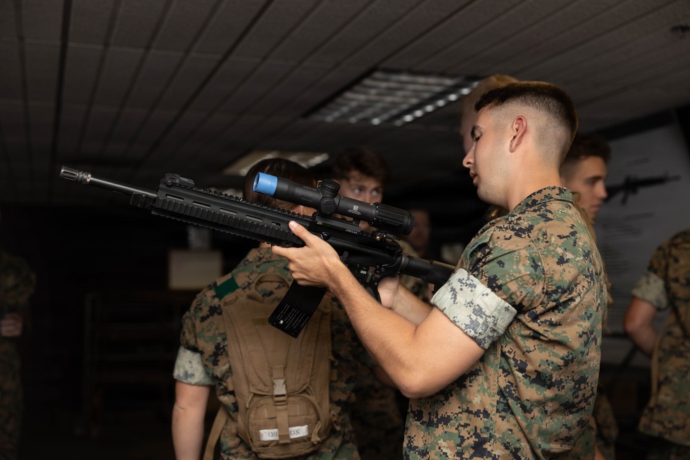 U.S. Naval Academy Midshipmen Train Indoor Simulated Marksmanship Trainer