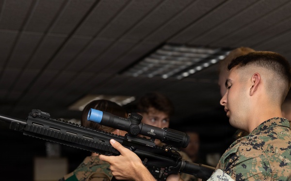 U.S. Naval Academy Midshipmen Train Indoor Simulated Marksmanship Trainer
