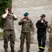 U.S. Army engineers and Polish firefighters exchange mechanical door breaching techniques at Bemowo Piskie