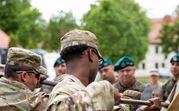U.S. Army engineers and Polish firefighters exchange mechanical door breaching techniques at Bemowo Piskie
