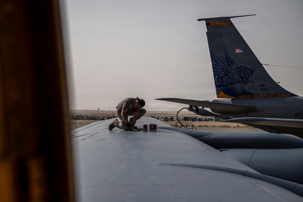 KC-135 conducts refueling operation with F-16 aircraft