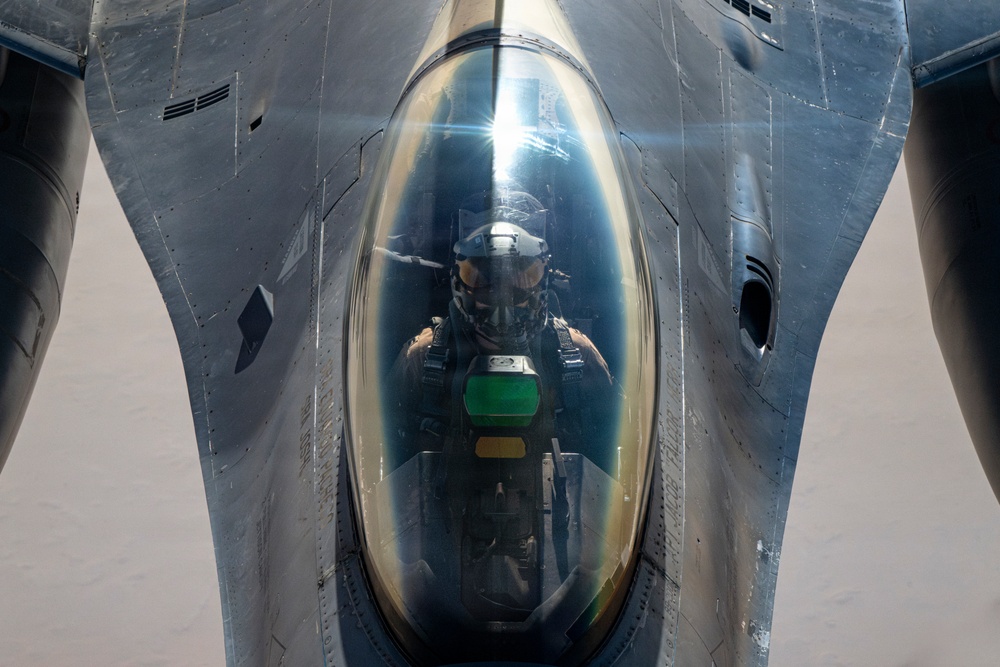 KC-135 conducts refueling operation with F-16 aircraft