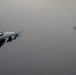 KC-135 conducts refueling operation with F-16 aircraft