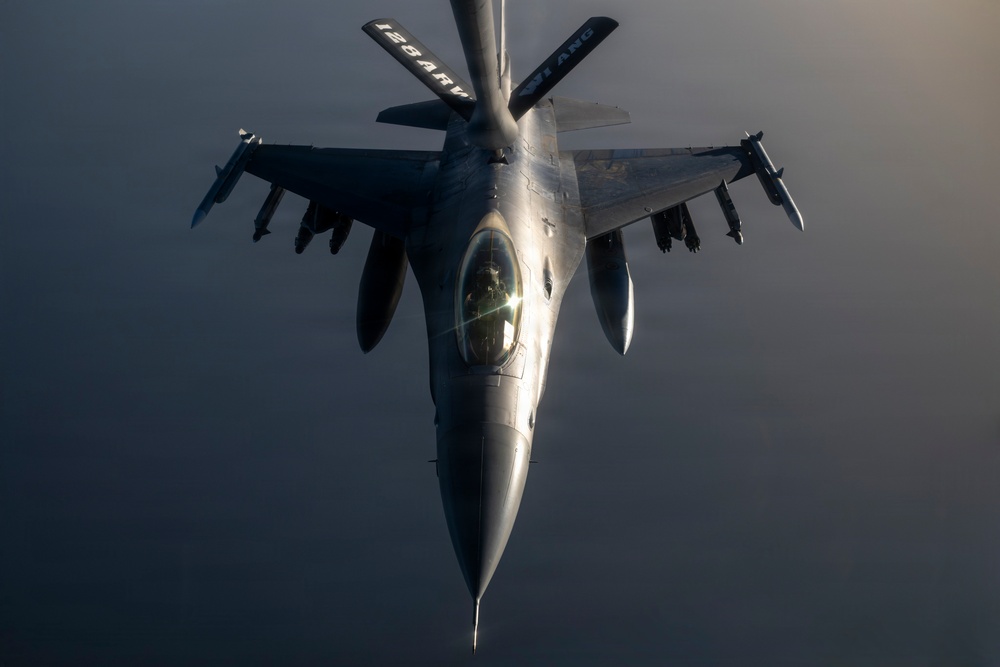 KC-135 conducts refueling operation with F-16 aircraft