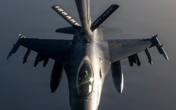 KC-135 conducts refueling operation with F-16 aircraft