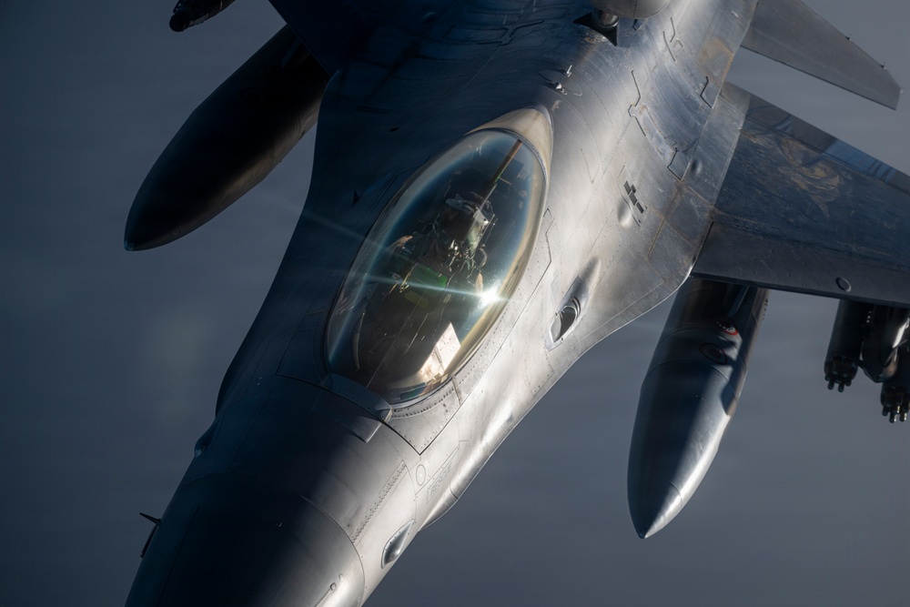 KC-135 conducts refueling operation with F-16 aircraft