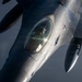 KC-135 conducts refueling operation with F-16 aircraft