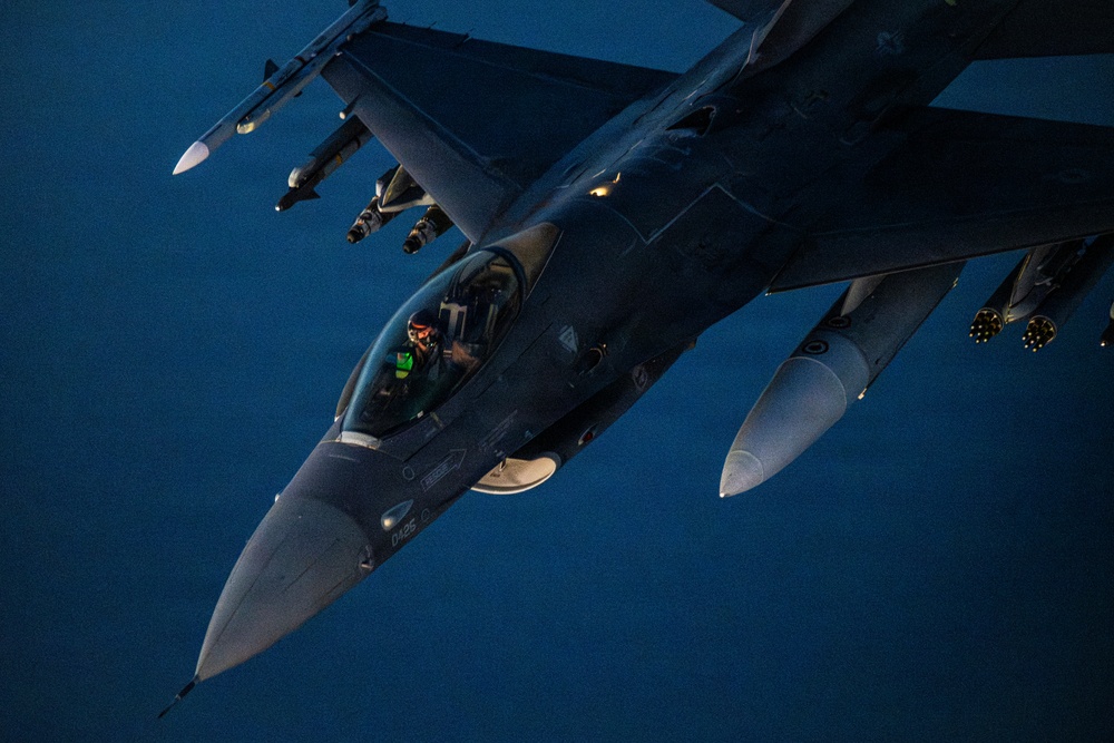 KC-135 conducts refueling operation with F-16 aircraft