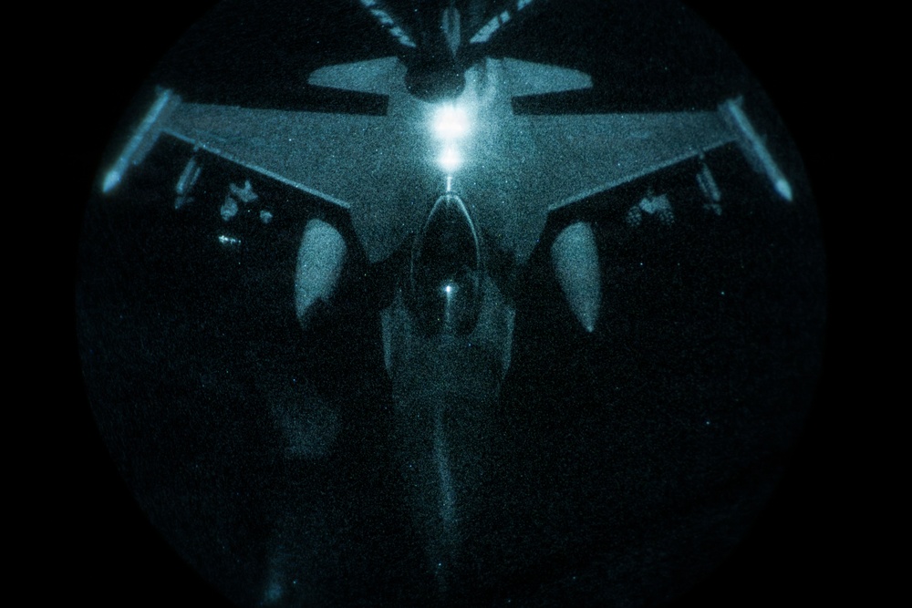 KC-135 conducts refueling operation with F-16 aircraft