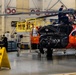 Coast Guard aircraft maintainers conduct maintenance on helicopter in Kodiak, Alaska