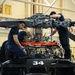 Coast Guard aircraft maintainers conduct maintenance on helicopter in Kodiak, Alaska