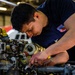 Coast Guard aircraft maintainers conduct maintenance on helicopter in Kodiak, Alaska