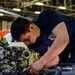 Coast Guard aircraft maintainers conduct maintenance on helicopter in Kodiak, Alaska