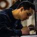 Coast Guard aircraft maintainers conduct maintenance on helicopter in Kodiak, Alaska