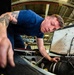 Coast Guard aircraft maintainers conduct maintenance on helicopter in Kodiak, Alaska