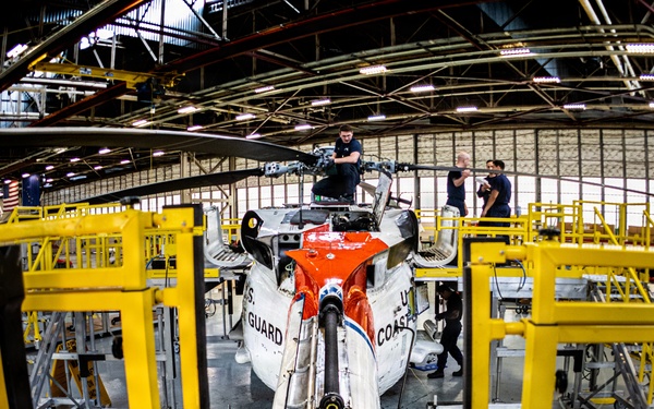 Coast Guard aircraft maintainers conduct maintenance on helicopter in Kodiak, Alaska