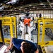 Coast Guard aircraft maintainers conduct maintenance on helicopter in Kodiak, Alaska