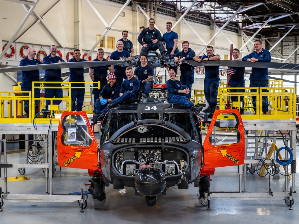 Coast Guard aircraft maintainers conduct maintenance on helicopter in Kodiak, Alaska