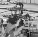 Coast Guard aircraft maintainers conduct maintenance on helicopter in Kodiak, Alaska