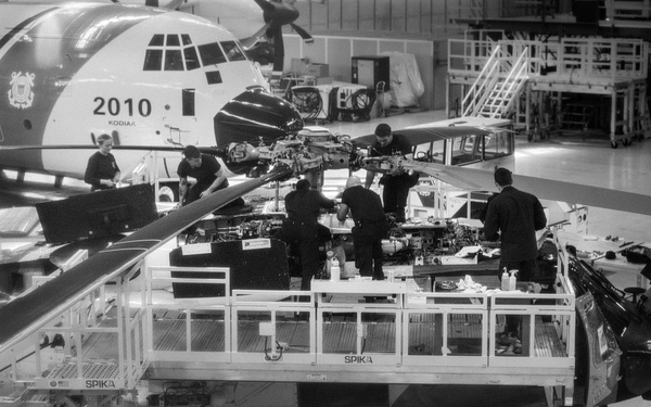 Coast Guard aircraft maintainers conduct maintenance on helicopter in Kodiak, Alaska
