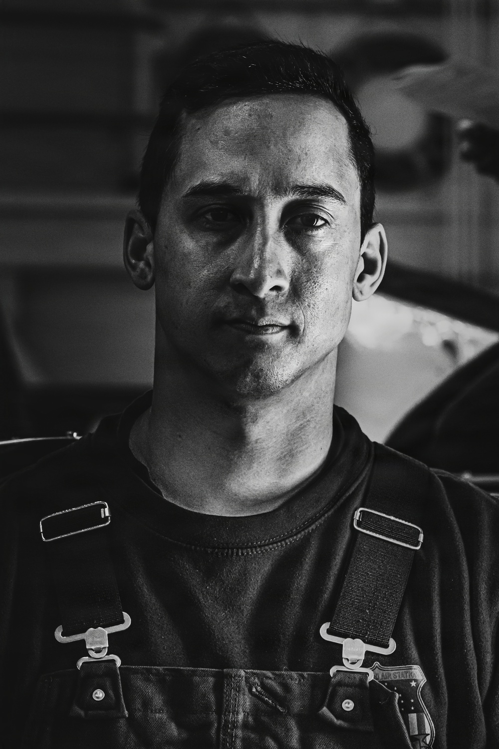 Coast Guard Air Station Kodiak maintainers sit for portraits during maintenance operations