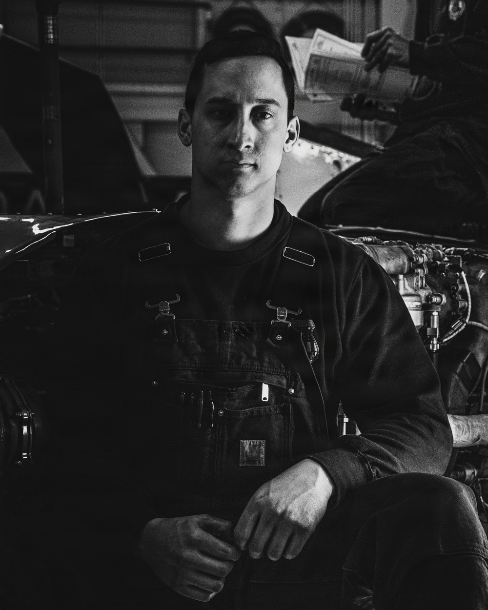Coast Guard Air Station Kodiak maintainers sit for portraits during maintenance operations