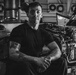 Coast Guard Air Station Kodiak maintainers sit for portraits during maintenance operations