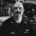 Coast Guard Air Station Kodiak maintainers sit for portraits during maintenance operations
