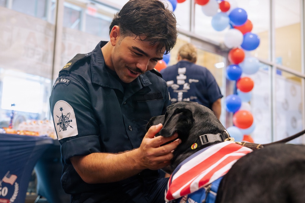 USO Hosts Dog and Paws Event at Julia Street Cruise Terminal during Sail 250