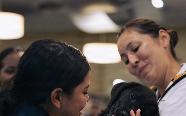 USO Hosts Dog and Paws Event at Julia Street Cruise Terminal during Sail 250