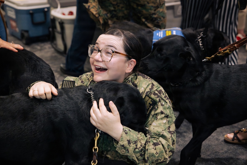 USO Hosts Dog and Paws Event at Julia Street Cruise Terminal during Sail 250