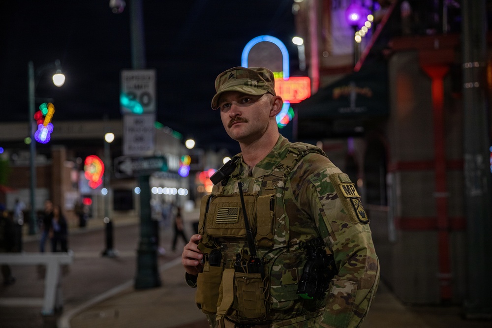 U.S. Army National Guard Military Police assigned to the Memphis Safe Task Force conduct a safety patrol of Beale Street