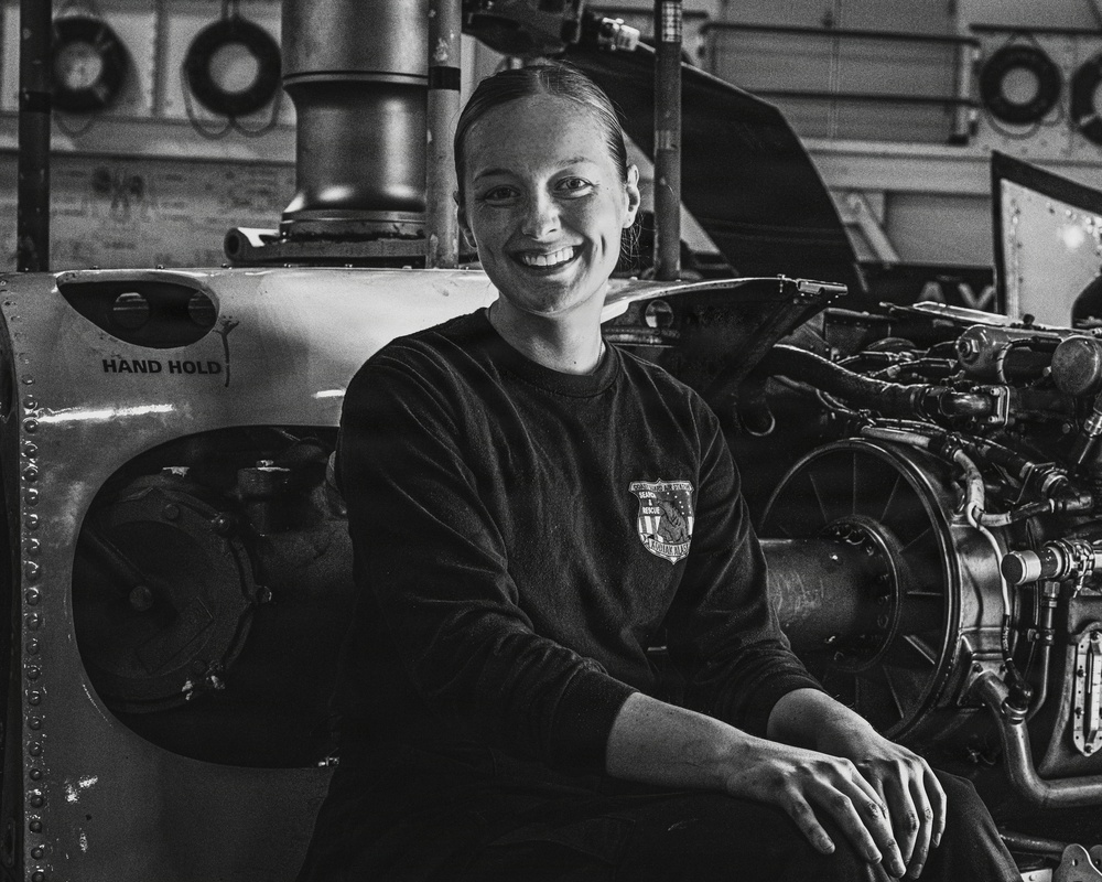 Coast Guard Air Station Kodiak maintainer sits for portrait during maintenance operations