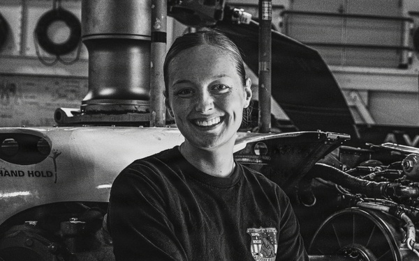 Coast Guard Air Station Kodiak maintainer sits for portrait during maintenance operations