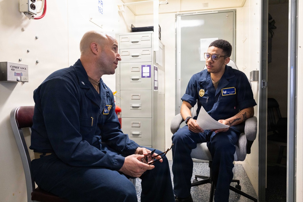 John F. Kennedy Sailors Study For Qualification