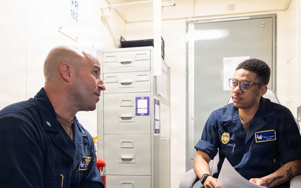 John F. Kennedy Sailors Study For Qualification