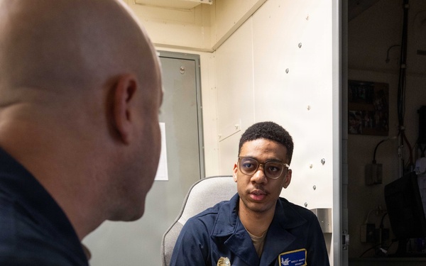 John F. Kennedy Sailors Study For Qualification