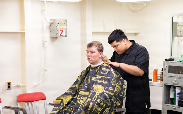 John F. Kennedy Sailor Cuts Hair