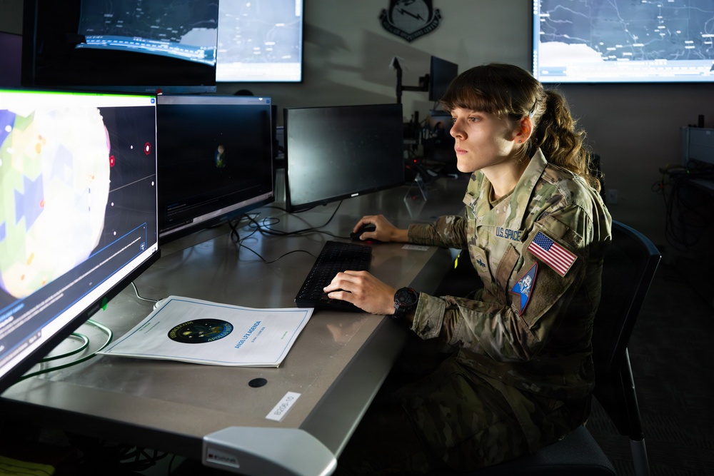 U.S. Space Force Guardian monitors space domain awareness systems at operations center