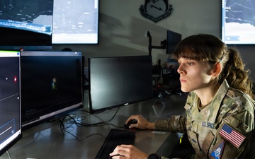 U.S. Space Force Guardian monitors space domain awareness systems at operations center