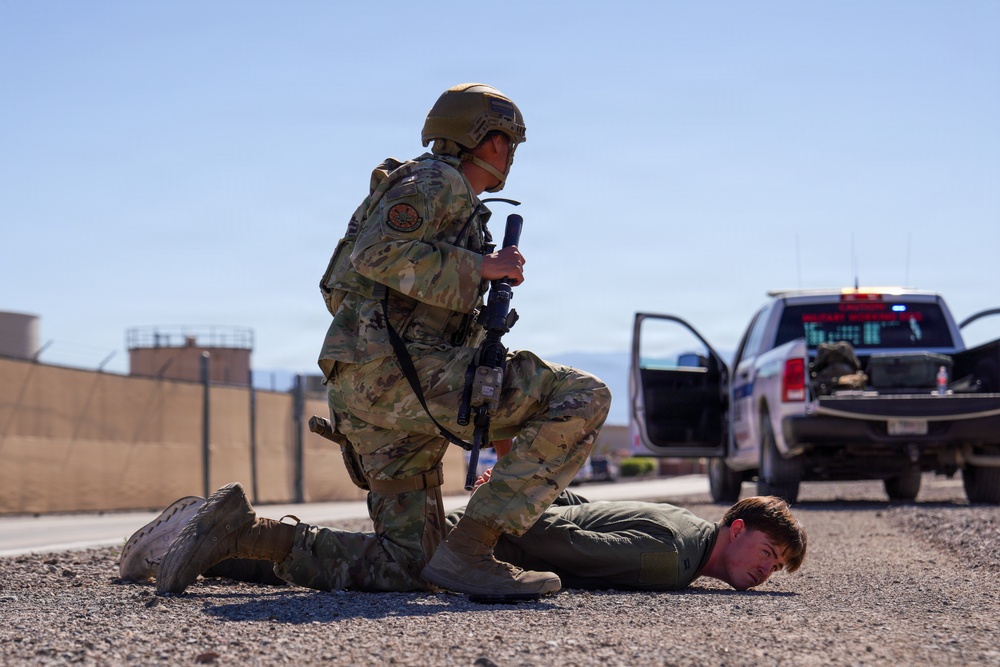 Combat readiness inspection integrates simulated threats; 432nd Wing Airmen respond